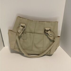 Tan and cream leather shoulder bag with double handles, zipper closure